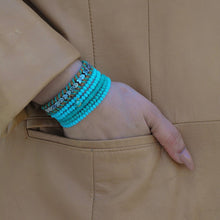 Load image into Gallery viewer, Silver plated hearts shape beads interlace with a neutral cord bracelet,Topaz Jewelry