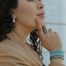 Load image into Gallery viewer, Silver plated hearts shape beads interlace with a neutral cord bracelet,Topaz Jewelry